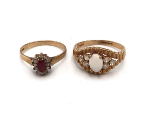 Two 9ct gold dress rings. To include an opal and white stone dress ring size P1/2. Together with a ruby and diamond cluster, 