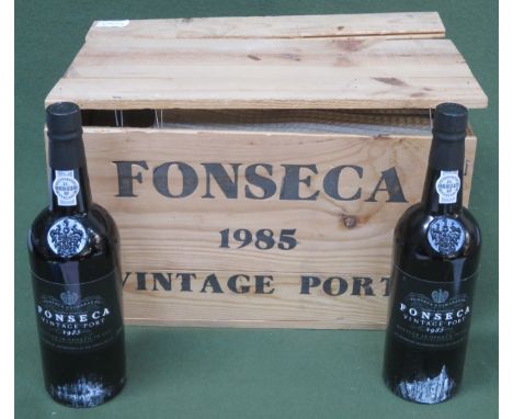 Wooden crate containing Twelve unopened bottles of Fonseca Guimaraens 1985 vintage port 