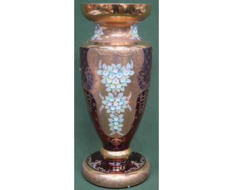 Impressive ruby venetian coloured venetian glass vase, with heavily gilded and floral decoration. 91cm High x 19cm Diameter 