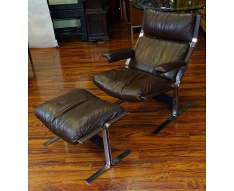 Vintage Brown Leather and Chromed Metal Recliner and Ottoman. Made In Switzerland. Leather in "As Found" condition. Well Worn