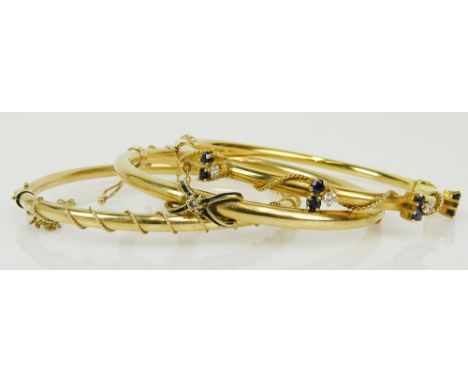 Three vintage 14 karat yellow gold bangle bracelets, one with small round cut diamonds and sapphires, one with small round cu