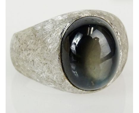 Men's vintage black star sapphire and 18 karat white gold ring. Sapphire measures 12mm x 10mm. Signed 750. Ring size 5-1/2. A