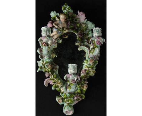 Antique Meissen Style Figural Porcelain Three (3) Light Mirrored Sconce. Decorated with Putti amidst Flowers. Unsigned. Minor