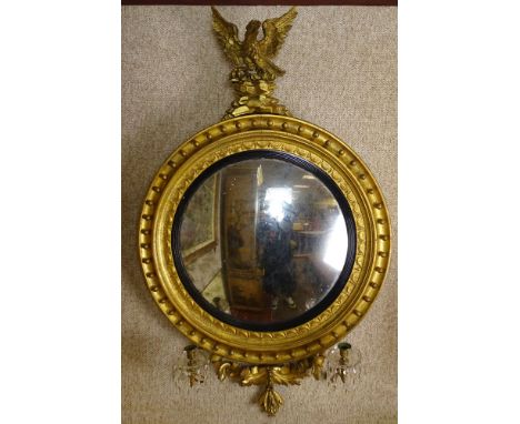Early 19th Century American Federal Carved and Gilt Wood Convex Mirror With Figural Eagle Finial. 2 Lights with Glass and Pri