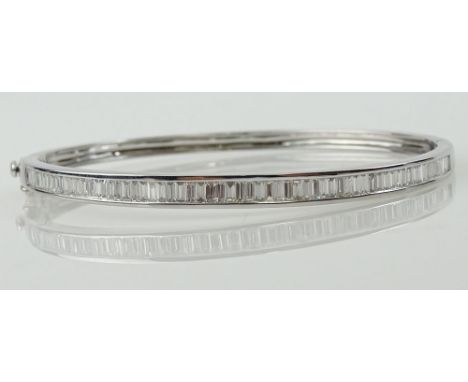 Lady's Baguette Diamond and 14 Karat White Gold Bangle Bracelet. Diamonds F-G Color, VS Clarity. Signed 14K. Very Good Condit
