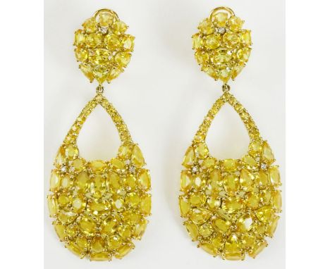 Pair of lady's fine quality approx. 48.0 carat mixed cut yellow sapphire. Yellow diamond and 18 karat yellow gold chandelier 