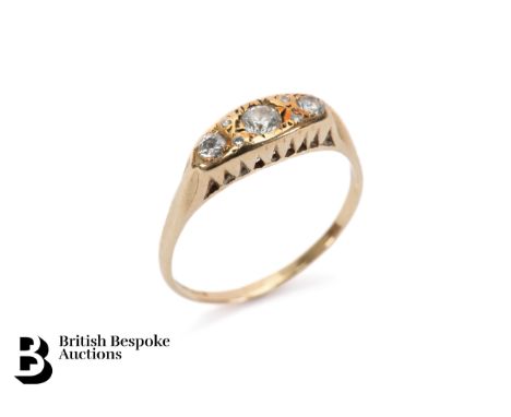 A 9ct yellow gold diamond ring, set with a center 16pt diamond, two 7pt dias and 3 pts of eight-cut dias, size Q, weight appr