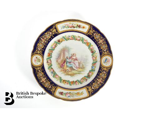 19th century Sevres cabinet plate, the central reserve painted in the Watteauesque manner, approx 24 cms diameter. The plate 