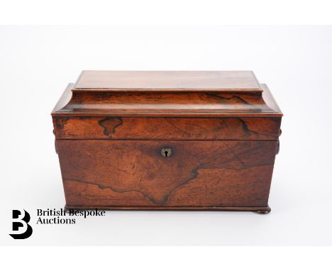 A Georgian sarcophagus shaped tea caddy, composed of two compartments for green and black tea, together with a glass mixing b