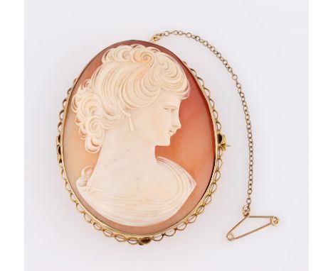 A cameo brooch, depicting a lady’s portrait in profile, frame stamped 9ct, measuring approx. 5.5x4.5cm.
