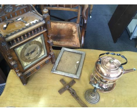 A mantle clock together with a copper kettle, a frame and two crucifixes.