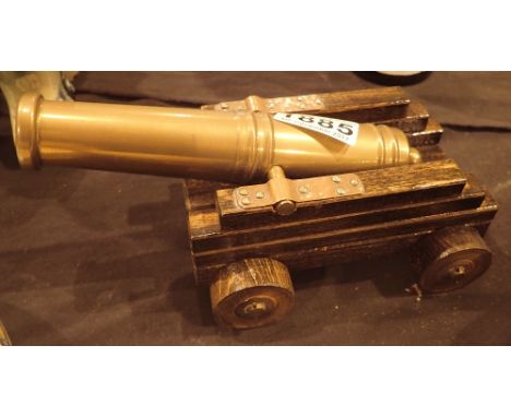 Vintage brass cannon with wooden carriage