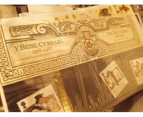 Album of British first day issue postage stamps and a small collection of mixed british coins