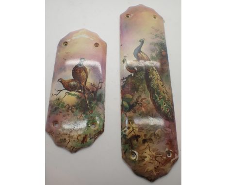 Two hand painted ceramic door pushes decorated with pheasants and peacocks