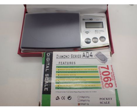 Two boxed digital scales