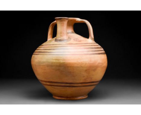Late Helladic IIIB, Late 14th-13th century BC A large decorated tan color pottery vessel having a round tapered body, twin op
