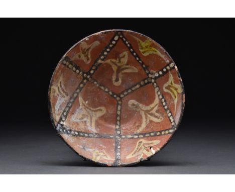 Persia, Nishapur, Ca. 9th century AD A ceramic bowl of truncated conical shape with a wide slightly concave foot. The interio