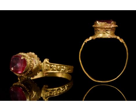 Ca. Late 15th / Early 16th century AD An ornate, gold ring of a flat-section hoop with inctricate designs to the shoulders, r