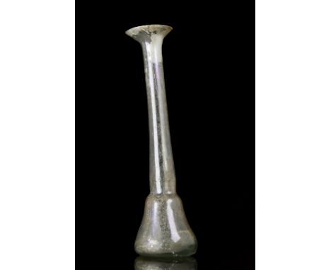 Ca. 100 AD A beautiful glass candlestick unguentarium with an out-turned rim, long cylindrical neck, and a bell-shaped body. 