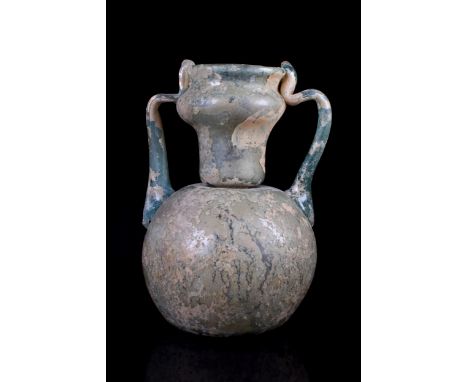Ca. 200-300 AD A beautiful light blue amphora with a globular-shaped body, and a poppy-head-shaped mouth. Two trailed handles