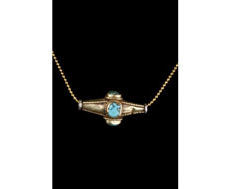 Ca. 1100-1200 AD A beautiful gold bead of elongated form intricately decorated with filigree designs and alternating cells se
