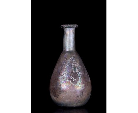 Ca. 100-300 AD A beautiful glass bottle with silver iridescence featuring a piriform body tapering to a long neck with a flat