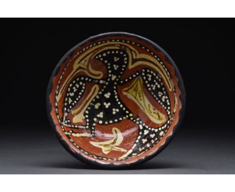 Iraq or Persia, Ca. 9th century AD A ceramic bowl of truncated conical shape with a wide ring foot. The interior is decorated