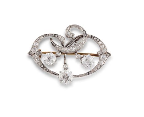 AN ART NOUVEAU DIAMOND BROOCH, CIRCA 1900Of stylised foliate design, the scrolls set throughout with old round brilliant and 