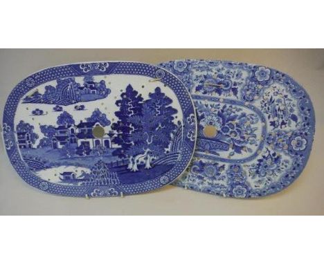 A 19th Century Nankeen semi-china blue and white transfer decorated meat satrainer, the centre field decorated with a vase of