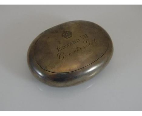 An Edwardian silver circular snuff box with hinged lid of plain form, bearing inscription to top "Edward VII Coronation Gift"