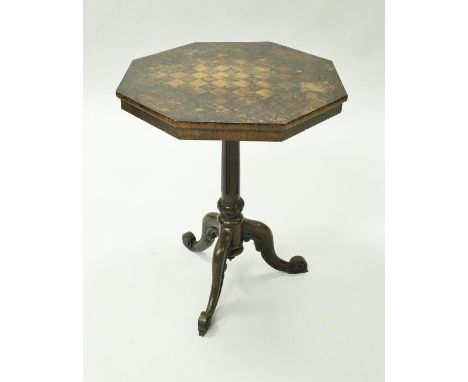 A circa 1820 octagonal topped rosewood games centre table in the Chinese taste, with chessboard inlaid top surrounded by vari