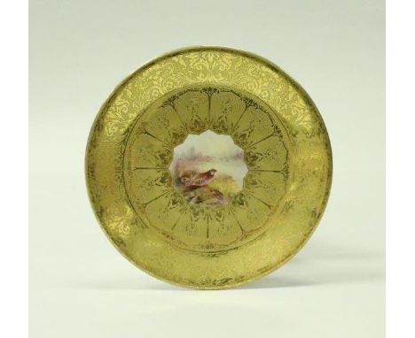 A Royal Worcester cabinet plate, the centre field decorated with partridge in a landscpe, with further partridge in flight in