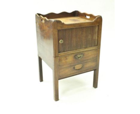 A George III mahogany night table with galleried tray top above the tambour fronted sliding door and pull-out drawer, opening