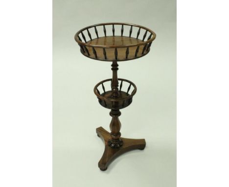 A 19th Century mahogany two-galleried tier occasional table, the top tier circular top raised on turned bobbin supports above