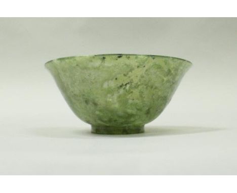 A carved jade Chinese bowl of translucent form, 10.5 cm x 4.25 cm