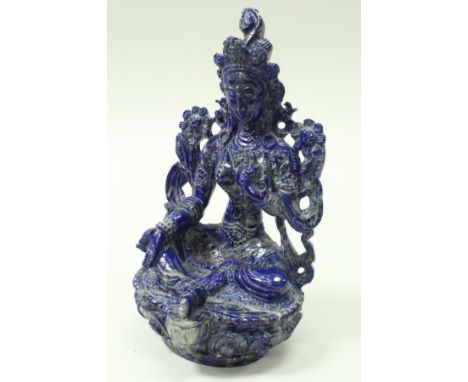 An Indian lapis lazuli carving of Tara meditating, a female Buddha, 22 cm high CONDITION REPORTS Unsure on age of carving as 