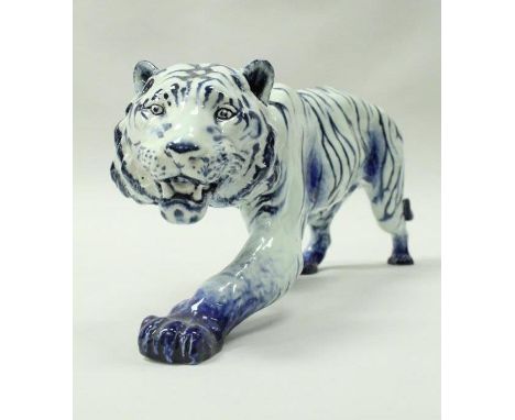 A Royal Doulton "Blue Flambé" figure of a stalking tiger designed by Charles Noke and painted by Frederick Moore bearing Noke