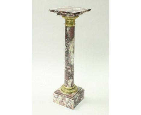 A 19th Century pink, white and black marble urn stand, the square top on a turned column support with brass embellishments to