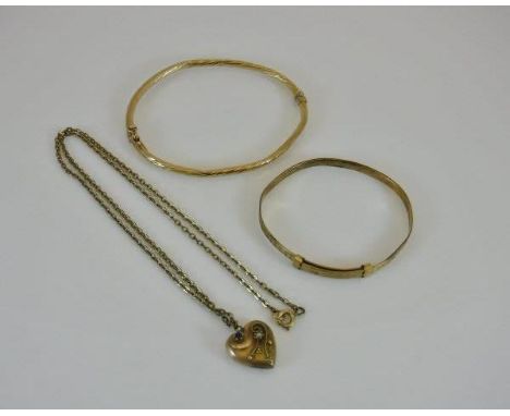 Two 9 carat gold bangles, together with a 9 carat gold heart-shaped pendant and chain, approx 13 g