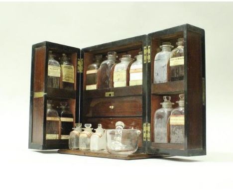 A 19th Century mahogany medicine cabinet, the two doors to the front opening to reveal fitted compartment for glass medicine 