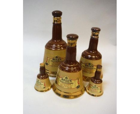 A collection of five pottery Bells Old Scotch Whisky bell-shaped bottles, 2 x 13⅓ fluid ounces and 2 x miniatures unopened, t