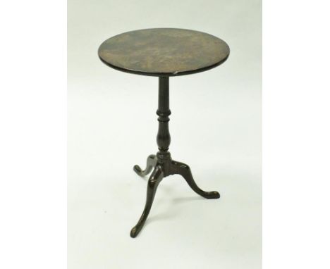 A George III mahogany tilt-top circular occasional table on a turned and collared baluster column to cabriole tripod base and