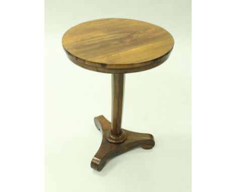 A 19th Century rosewood circular occasional table with plain frieze on a faceted octagonal column to tripod platform base, 54