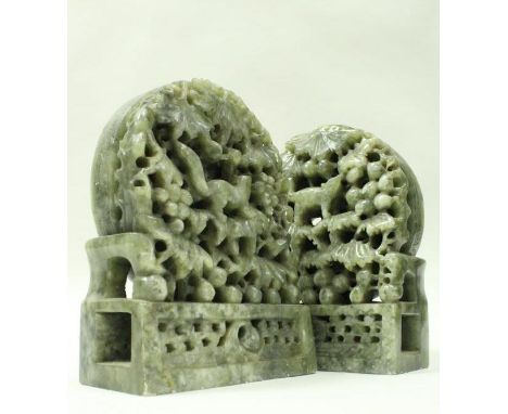 A pair of 19th Century Chinese carved jade book ends with arched tops, carved and pierced bodies featuring squirrel amongst b