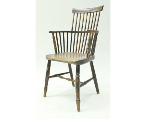 A 19th Century Thames Valley yew wood beech and elm stick back elbow chair with shaped seat on turned legs united by turned s