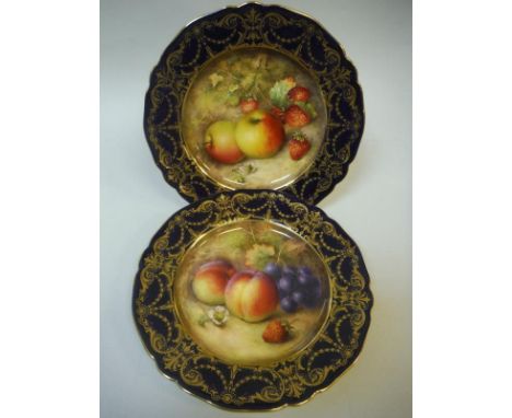 A pair of Royal Worcester cabinet plates, one centre field decorated with apples and strawberries, the other with peaches, gr