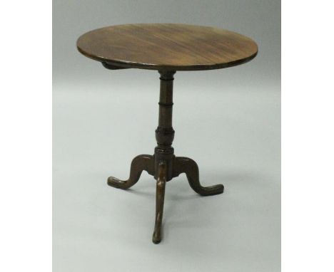A 19th Century mahogany tea table, the plain circular top on a turned and collared pedestal to cabriole tripod base, 69 cm x 