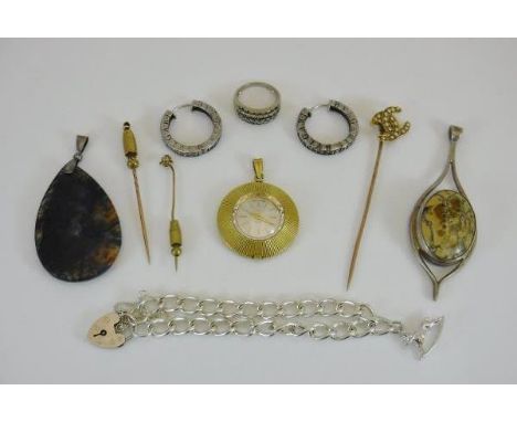 A collection of jewellery to include three stick pins, a moss agate pendant, a Georg Jensen style pendant, a pair of Bulgari 