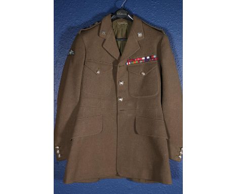 British Army uniform, a British Army khaki green jacket with Jones Chalk and Dawson Ltd of London label having 5th Royal Inni