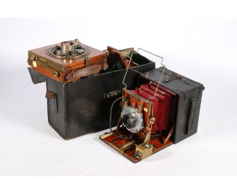 Vintage wooden bellows plate camera 'The Junior Sanderson' with Goerz Patent 7" lens, in case with some accessories. Also, a 